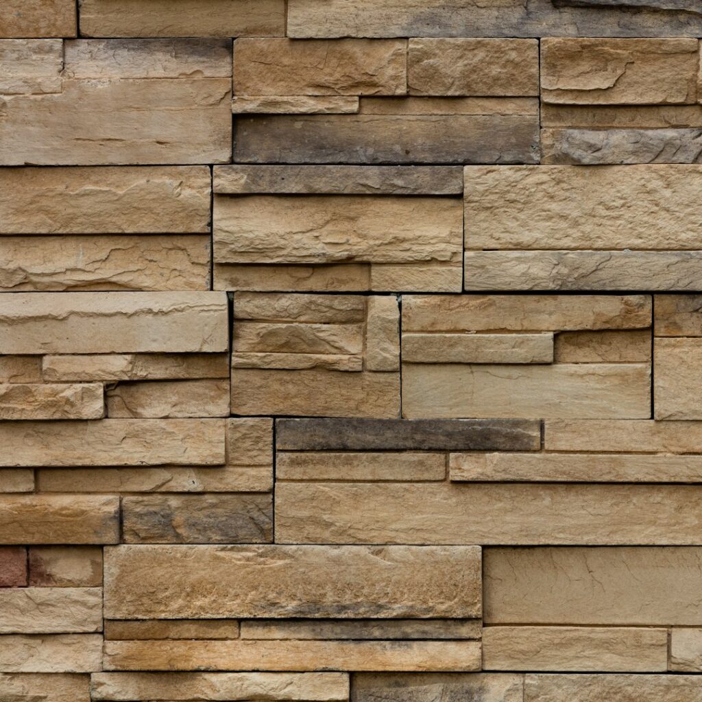 Finished stacked stone veneer wall in warm tan and gray tones